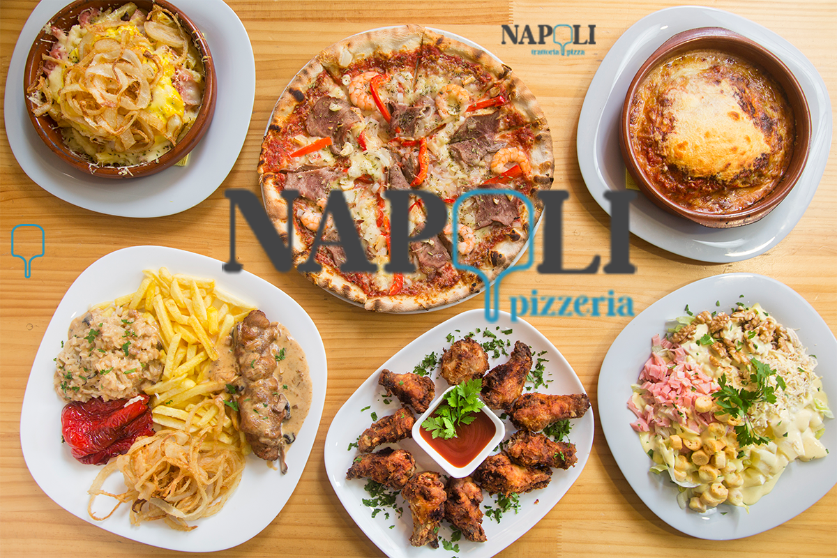 Top view of Italian lunch plates including pasta, salad, wraps, and pizza at Napoli Pizzeria in Montclair, NJ